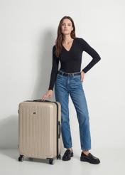 Large suitcase on wheels WALAB-0053-0X-29(W26), diagonal view of the product next to the model's silhouette.
