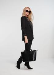 Elegant women's shopper bag TOREC-0953A-97(Z25), product view on the model. The entire silhouette is visible.