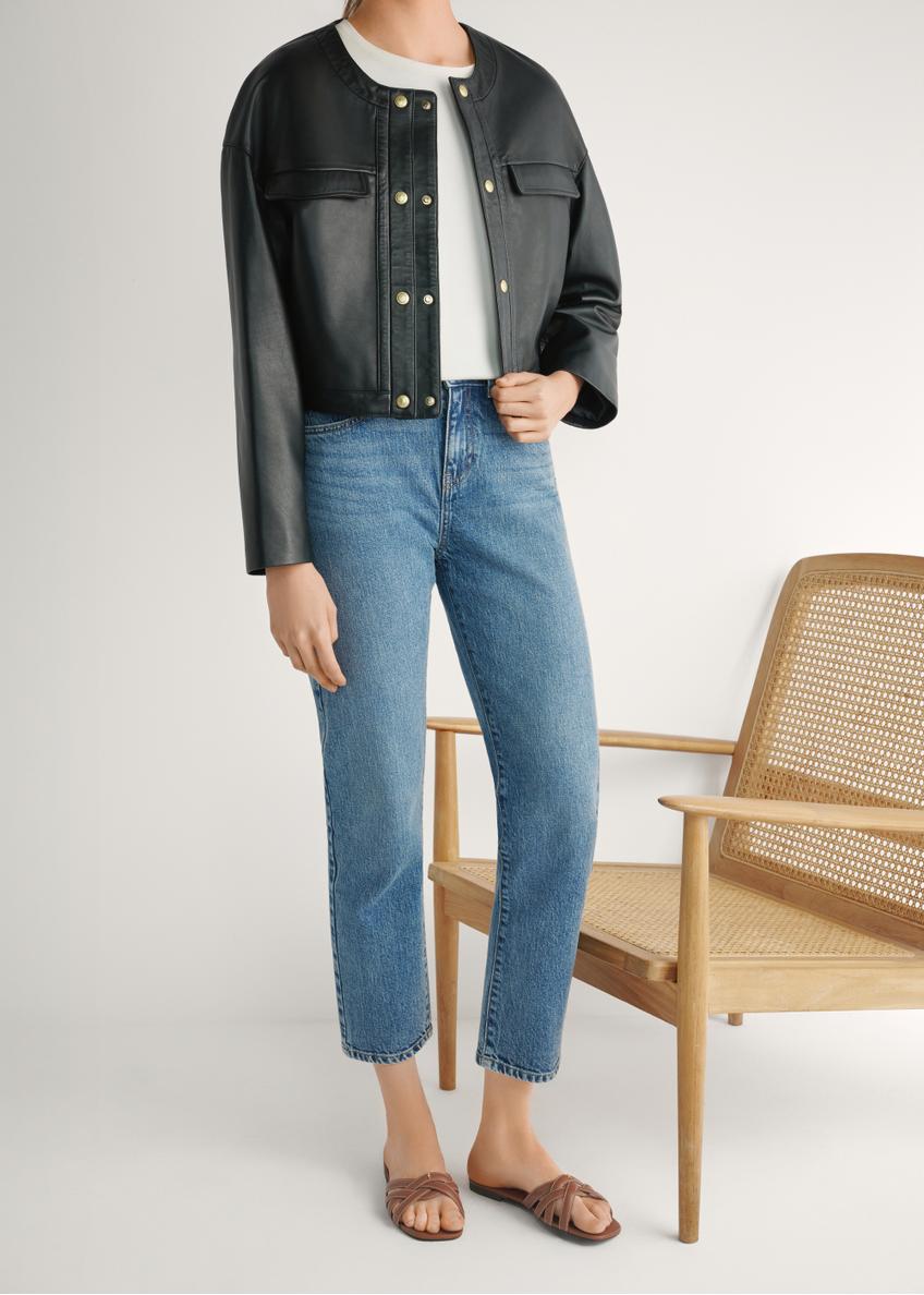 Women's camel leather slides with braid BUTYD-1222-1D(W26), front view of the product on the model's feet, on a light background.