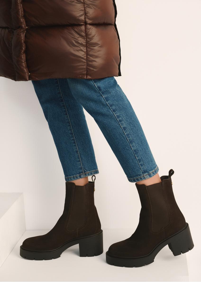 Women's brown suede high-heeled ankle boots BUTYD-1094-89(Z25) - side view of the product on a model against a white background. Knee-length silhouette visible.