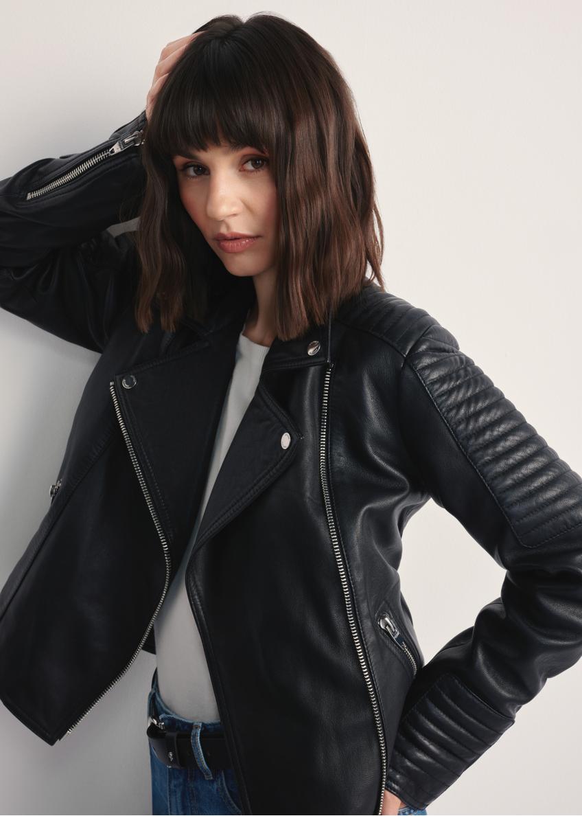 Women's black leather jacket KURDS-0560-3943(Z25), close-up of the product on the model. Half of the silhouette visible.