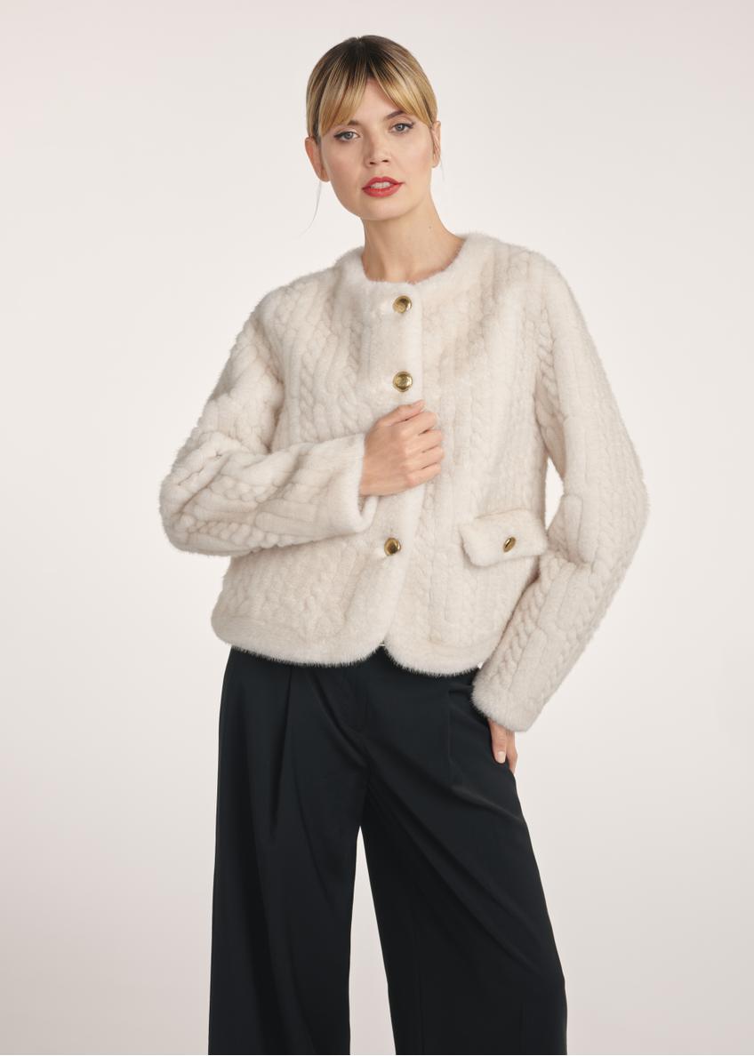 Short women's fur coat in cream color FUTDP-0075-81(Z25) - front view of the product on a model on a white background. Half of the silhouette visible.