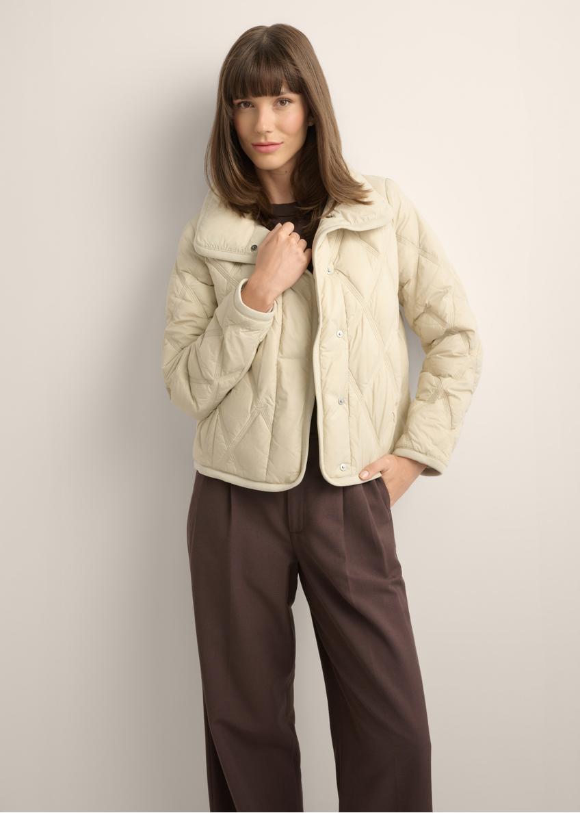 Beige women's transitional jacket KURDT-0664-1A(Z26), front view of the product on the model. Half of the silhouette visible.