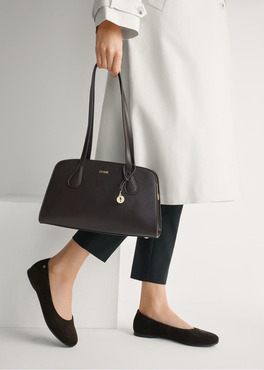 Women's suede ballet flats in brown color BUTYD-1247-1I(W26), side view of the product on the model's feet.