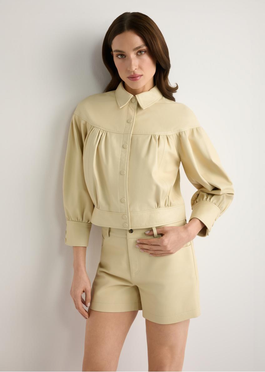 Light yellow leather women's shorts SPODS-0035-2A(W26), front view of the product on the model, half of the silhouette visible.-02