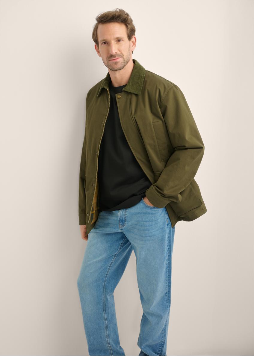 Men's green transitional jacket KURMT-0440-8B(Z26), front product view on model. Half silhouette visible.
