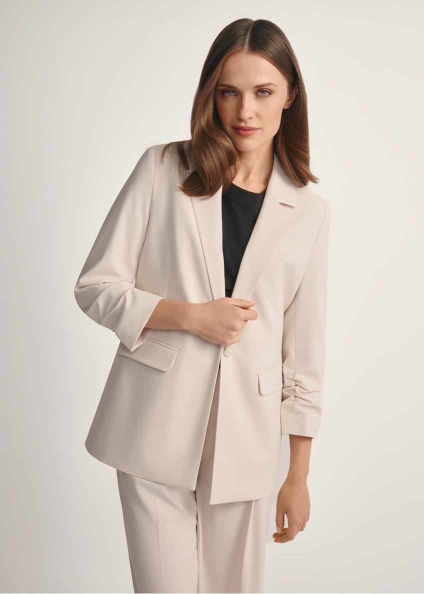 Women's light beige jacket ZAKDT-0043-1A(W26), product view from the front on the model, half of the silhouette visible.