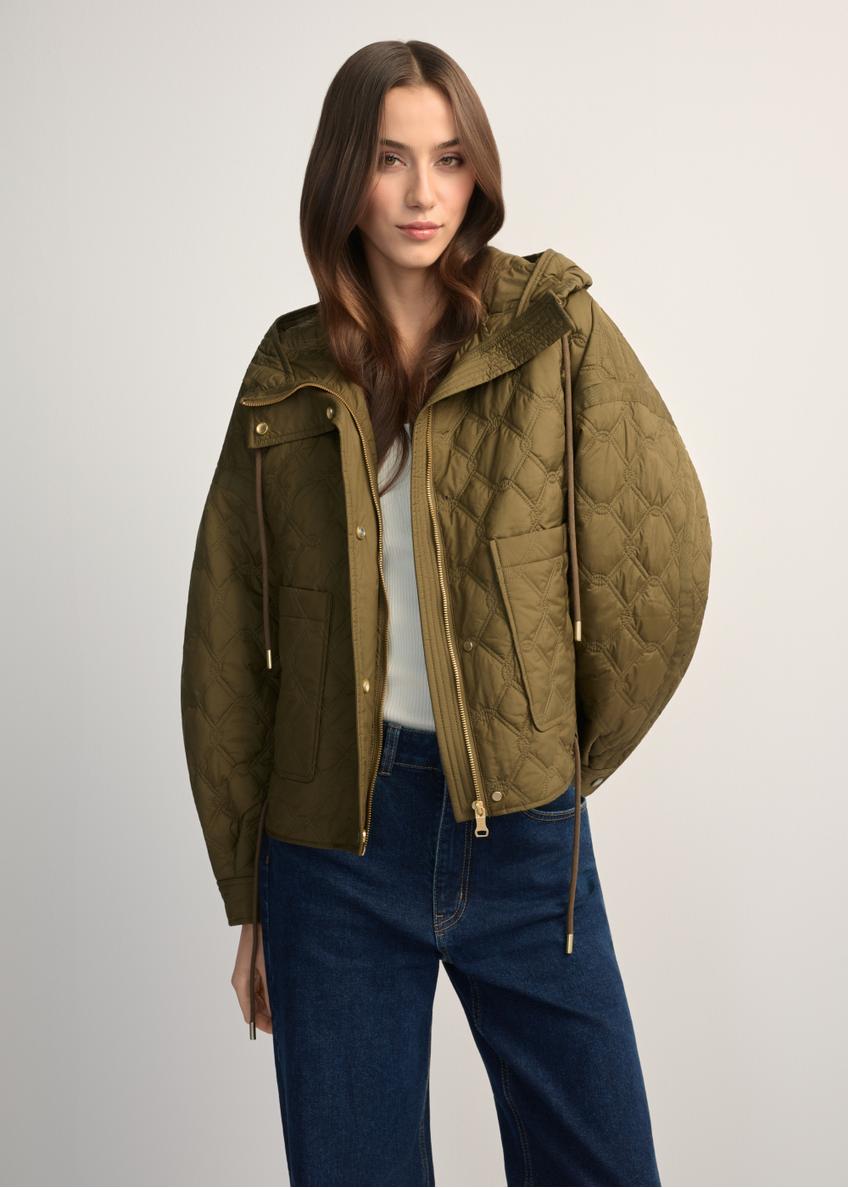 Olive green short quilted oversize jacket KURDT-0660-8D(W26) - front view of the product, on a model, against a light background. Half of the silhouette visible.