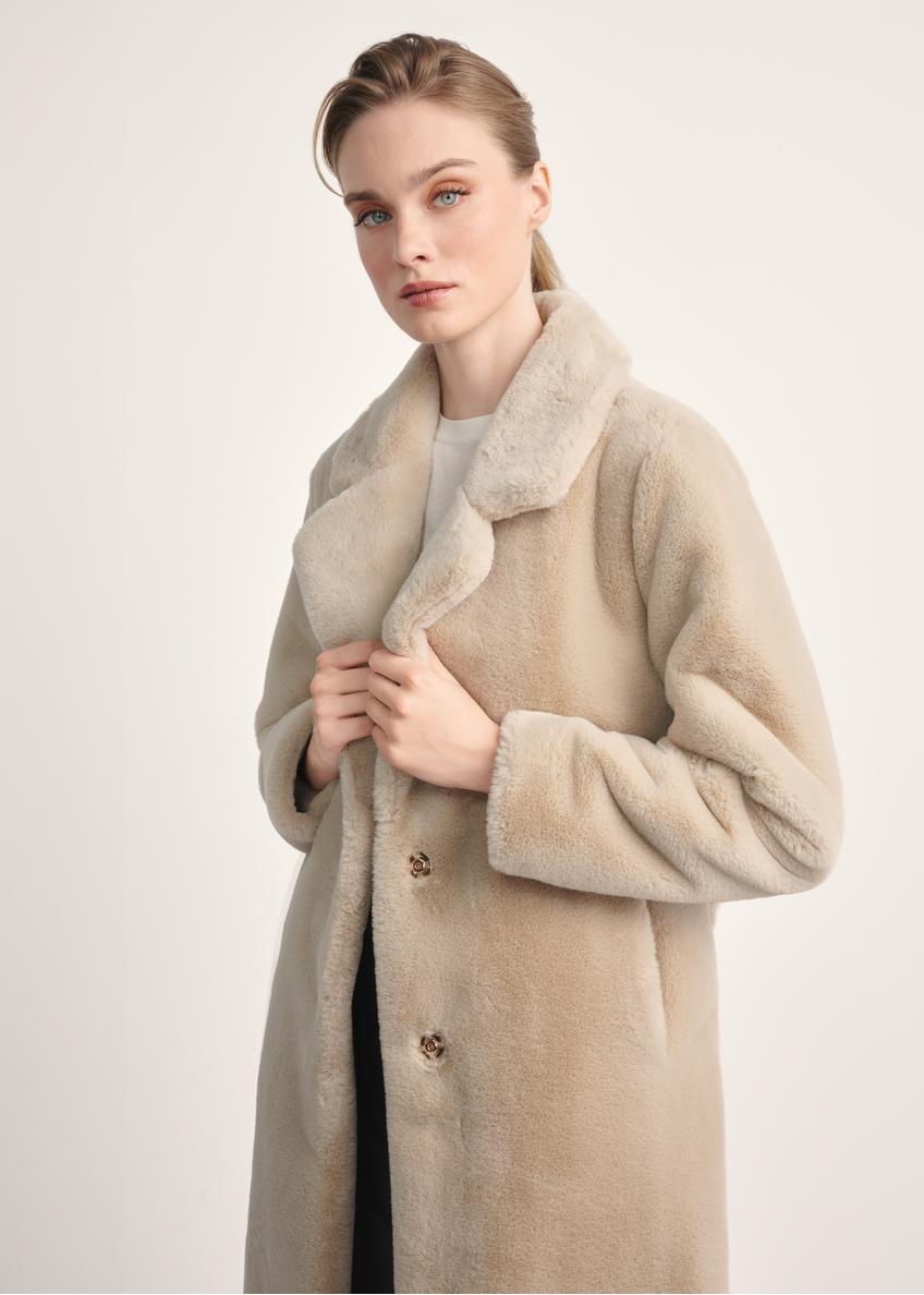 Women's faux fur coat with a belt FUTDP-0002A-81(Z24), the product is visible diagonally on the model, half of the silhouette is visible.