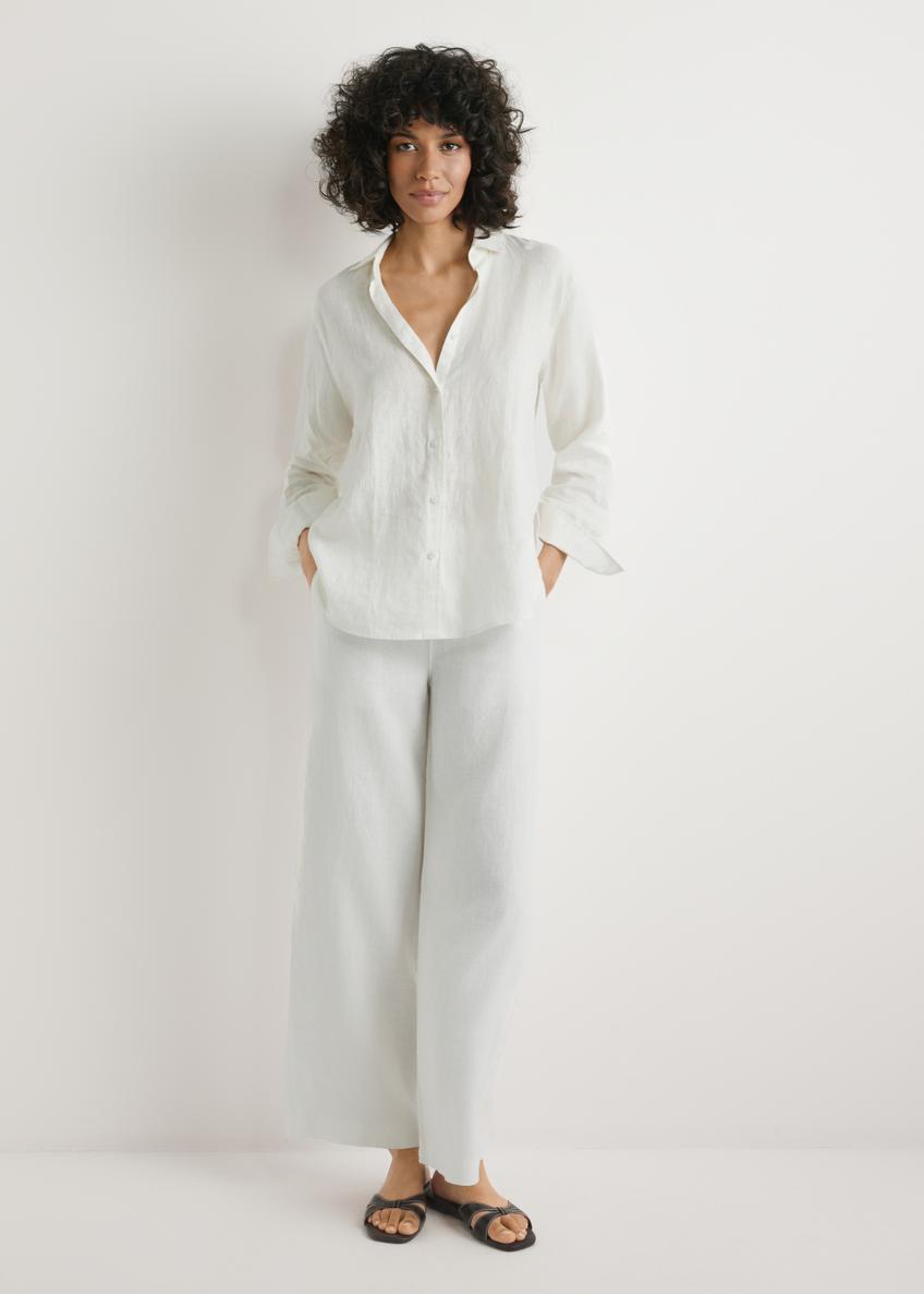 Light beige linen women's trousers SPODT-0124-1A(W26), front view of the product on the model, the whole silhouette is visible.