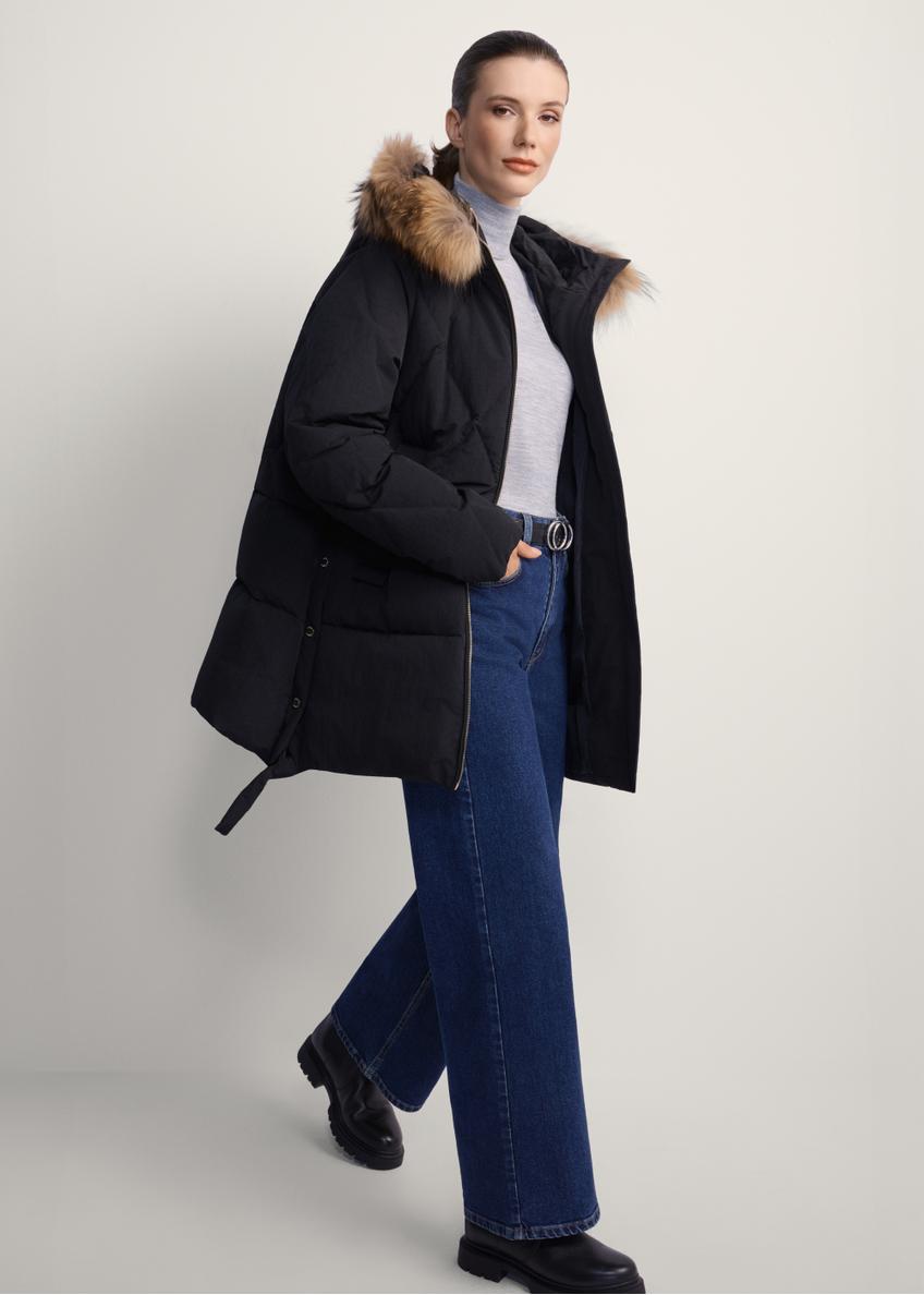 Black women's jacket with fur KURDT-0480-99(Z25), side view of the product on the model, the whole silhouette is visible.