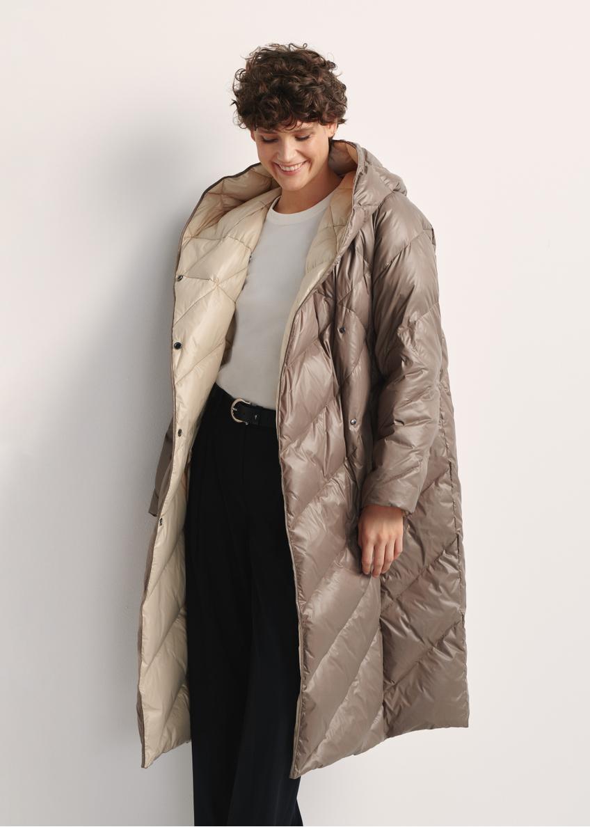 Long olive women's winter jacket KURDT-0542A-57(Z25), front view of the product on the model, part of the silhouette visible.