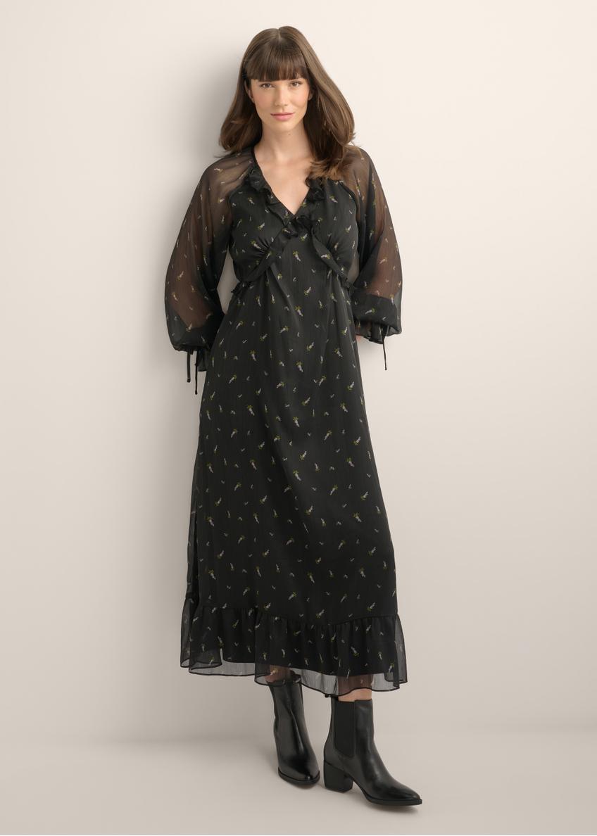 Black maxi dress with a lilac pattern and ruffles SUKDT-0290-9P(Z26), product view from the front on the model. Full body visible.