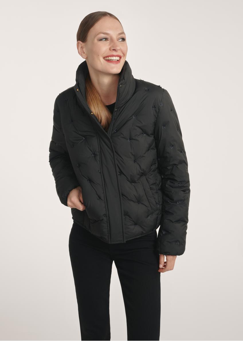 Black women's winter jacket KURDT-0614-99(Z25), front view of the product on the model, half of the silhouette visible.