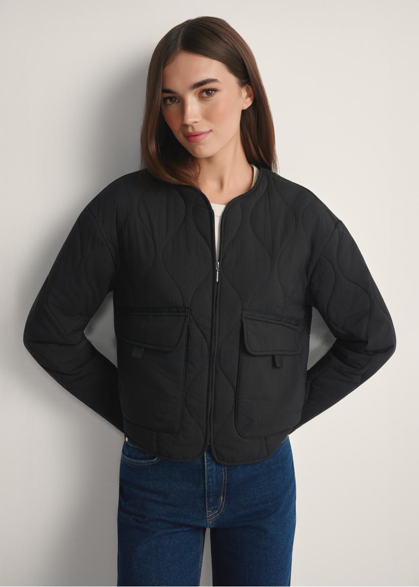 Black women's transitional nylon jacket KURDT-0656-99(W26), front view of the product on the model, half of the silhouette visible.