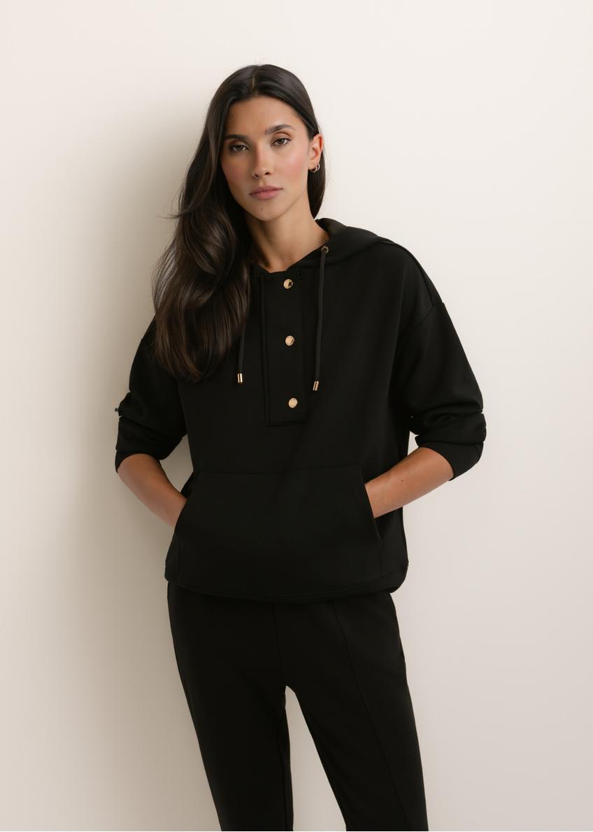 Black women's hoodie BLZDT-0111A-99(W26), front view of the product on the model. Half of the silhouette visible.