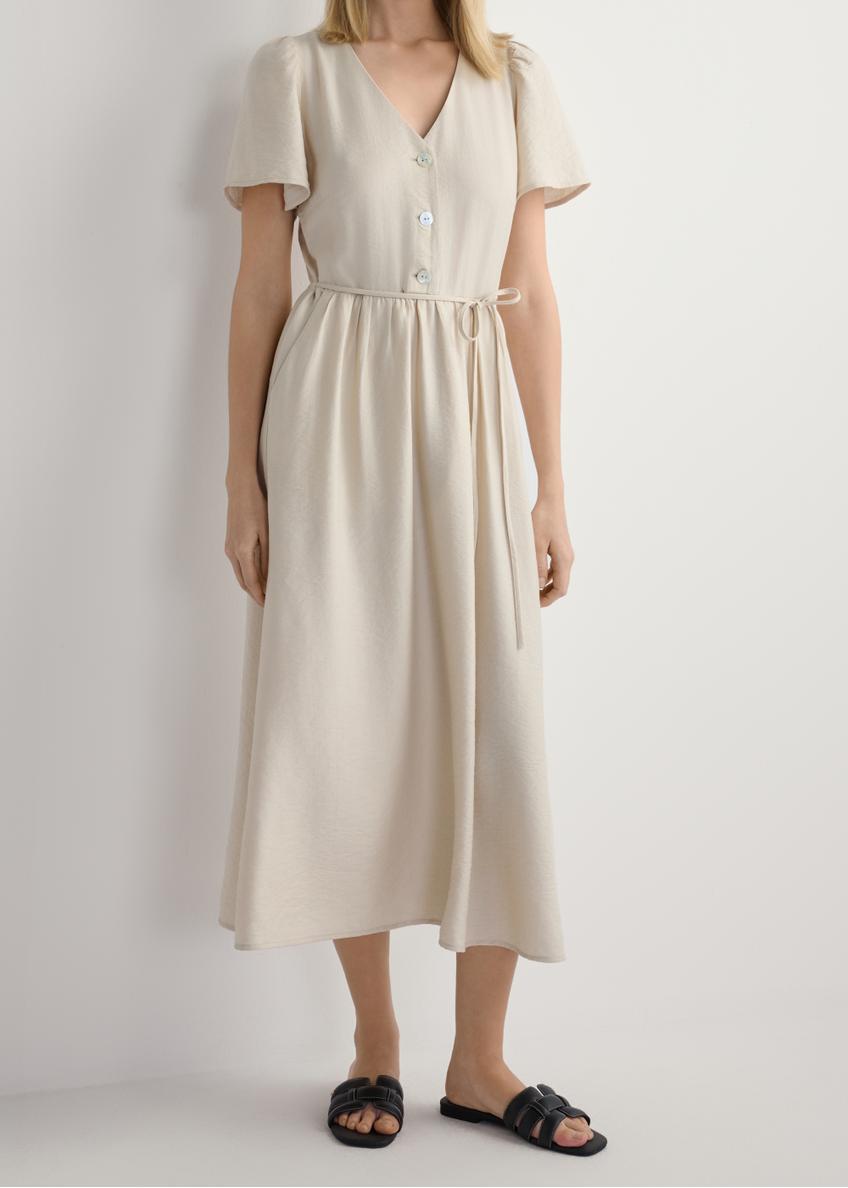 Women's black leather braided slides BUTYD-1225-99(W26), front view of the product on the model's feet, against a white background. Half of the silhouette visible.