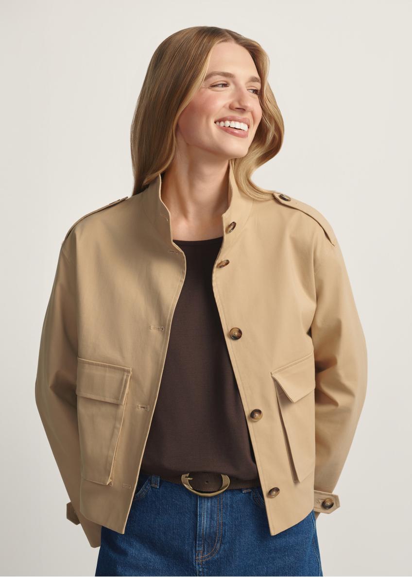 Beige women's transitional jacket KURDT-0628-1B(W26) - front view of the product, on a model, against a light background. Half of the silhouette visible.