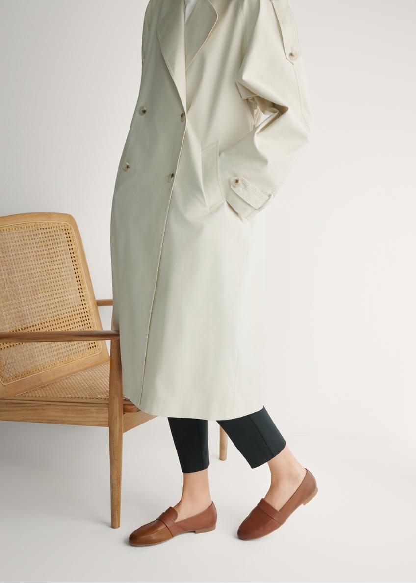 Women's leather moccasins in cognac color BUTYD-1074A-1F(W26), side view of the product on the model's feet.