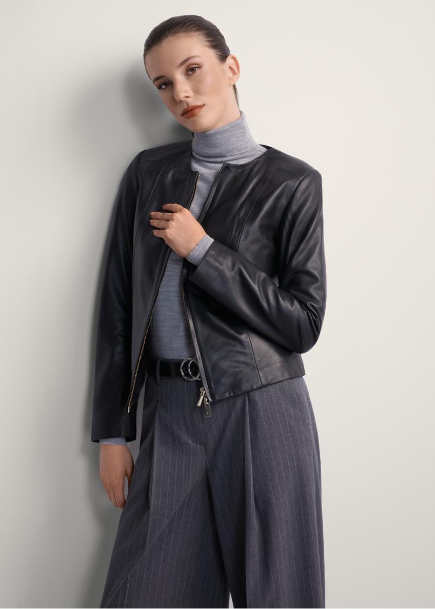 Women's fitted leather jacket KURDS-0209-4233(KS), front view of the product on the model. Half of the silhouette visible.