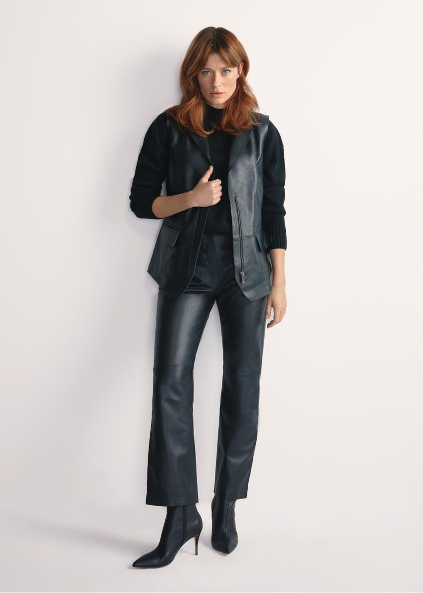 Women's black leather vest KAMDS-0010-5344(W25), product view from the front on the model, the entire silhouette is visible.