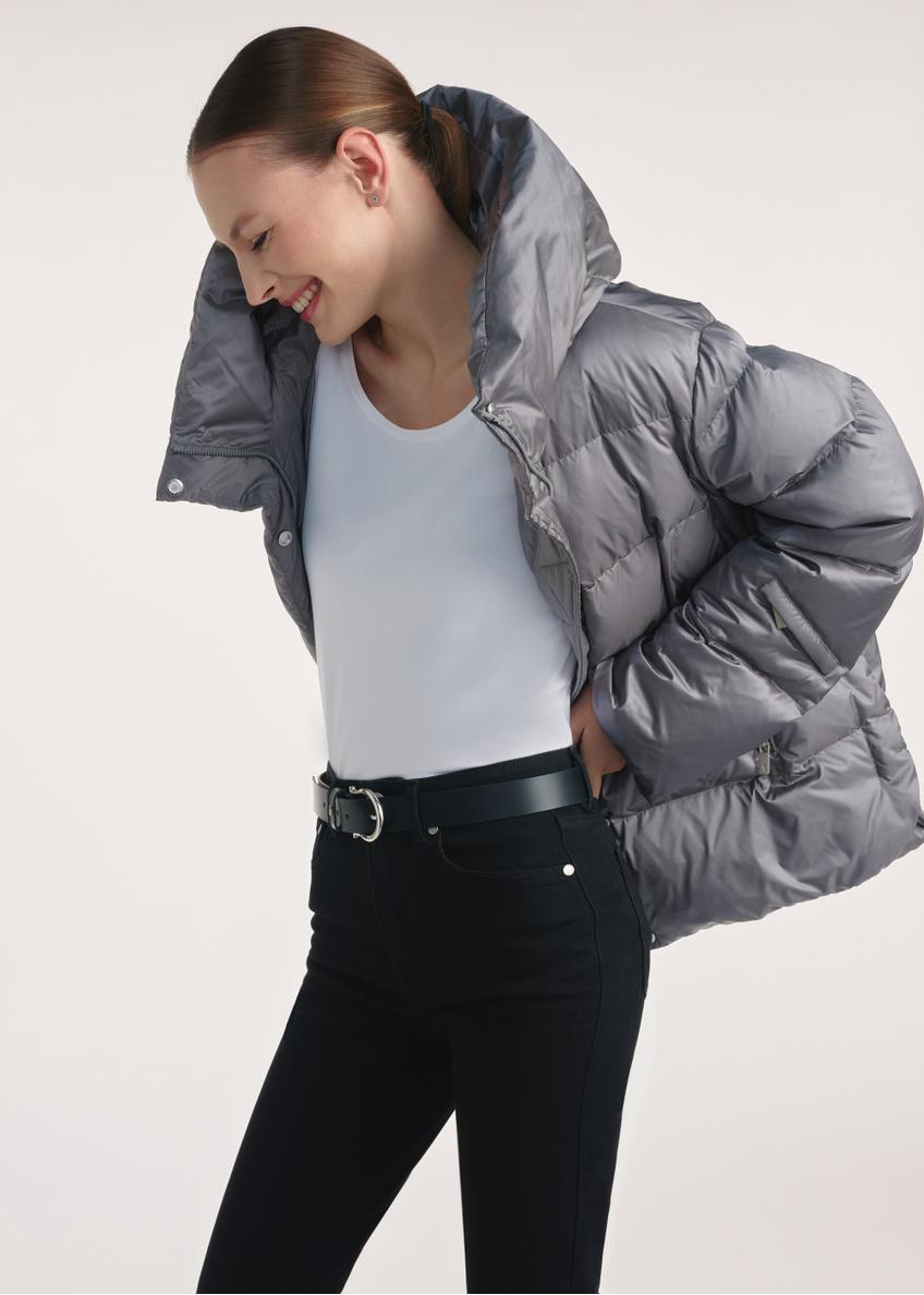 Gray women's down jacket KURDT-0585-91(Z25), side view of the product on the model, half of the silhouette visible.