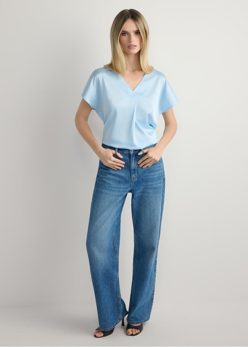 Light blue women's blouse BLUDT-0206-7A(W26), front view of the product on the model. Full body visible.