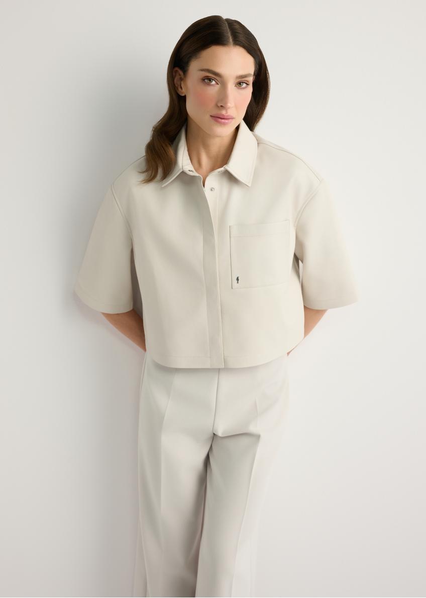 Women's short cream leather shirt KOSDS-0005-0P(W26), front view of the product on the model. Half of the silhouette visible.