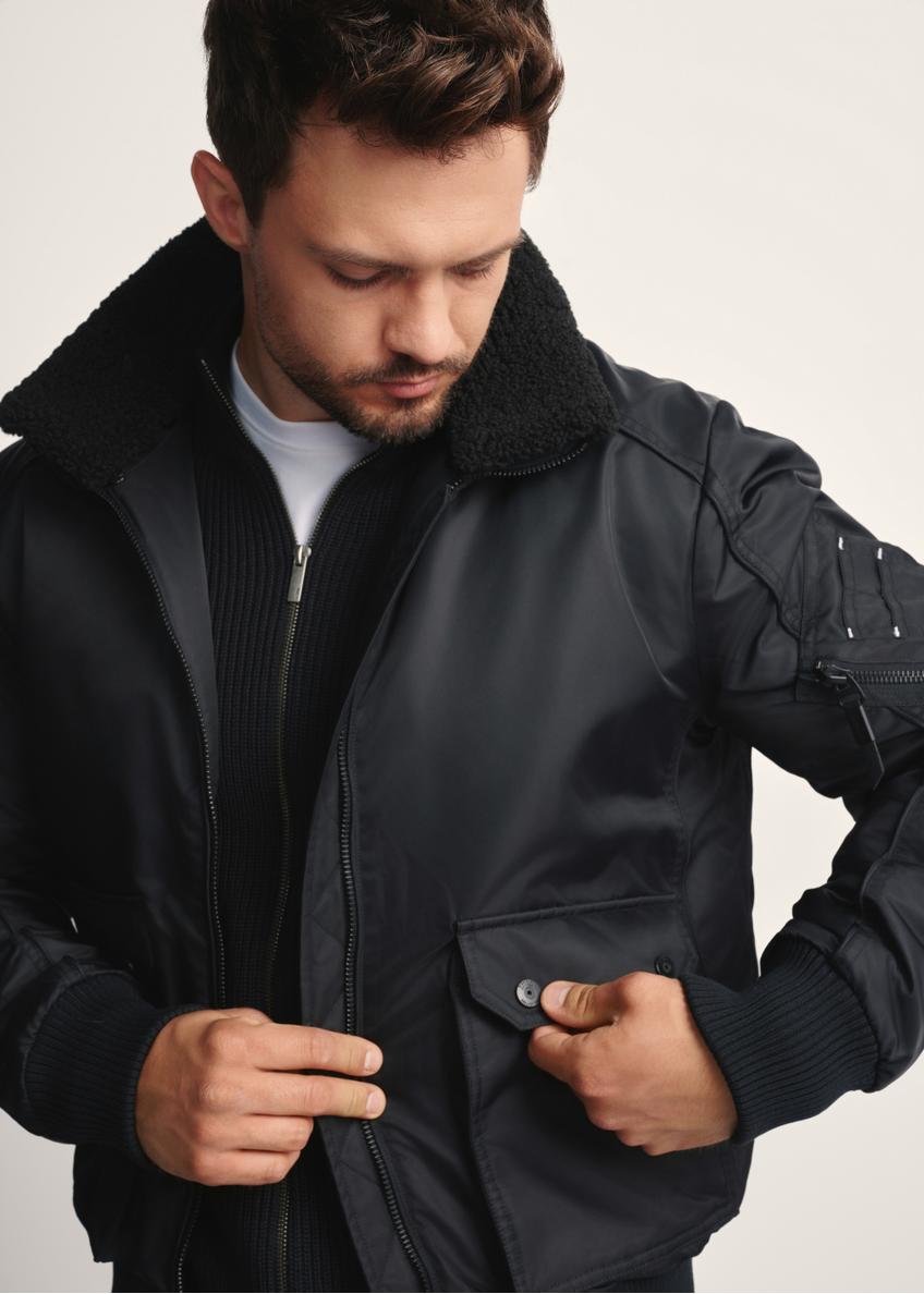 Black men's jacket with collar KURMT-0399-99(Z25), close-up of the product detail on the model.