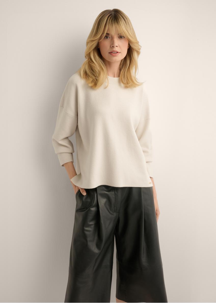 Light beige women's sweater SWEDT-0263-1A(Z26), front view of the product on the model. Half of the silhouette visible.