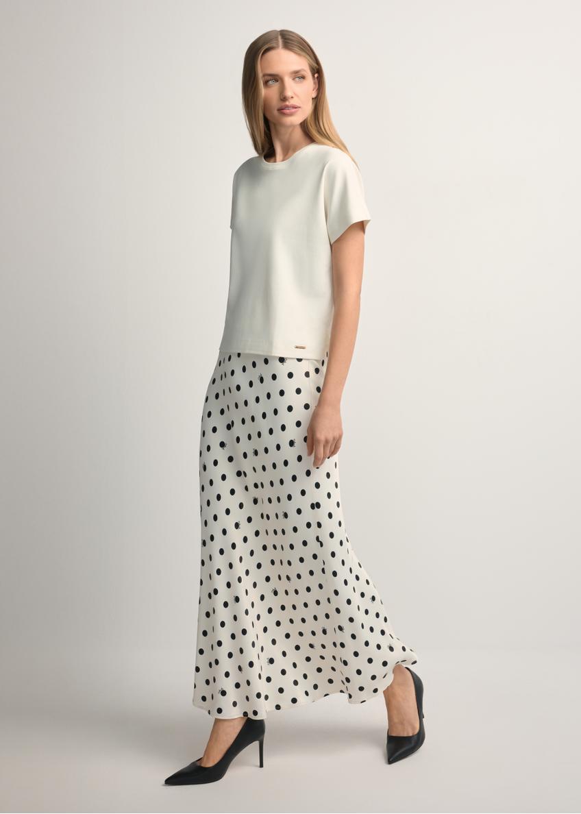 Women's white polka dot skirt SPCDT-0122-0P(W26), front view of the product on the model. Full body visible.