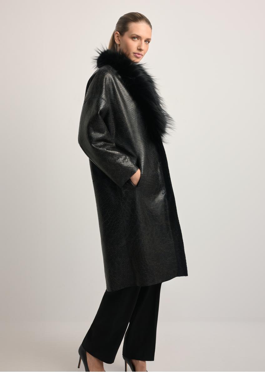 Black leather double-sided women's sheepskin coat KOZDS-0093-1396(Z25), side view of the product on the model. Full body visible.