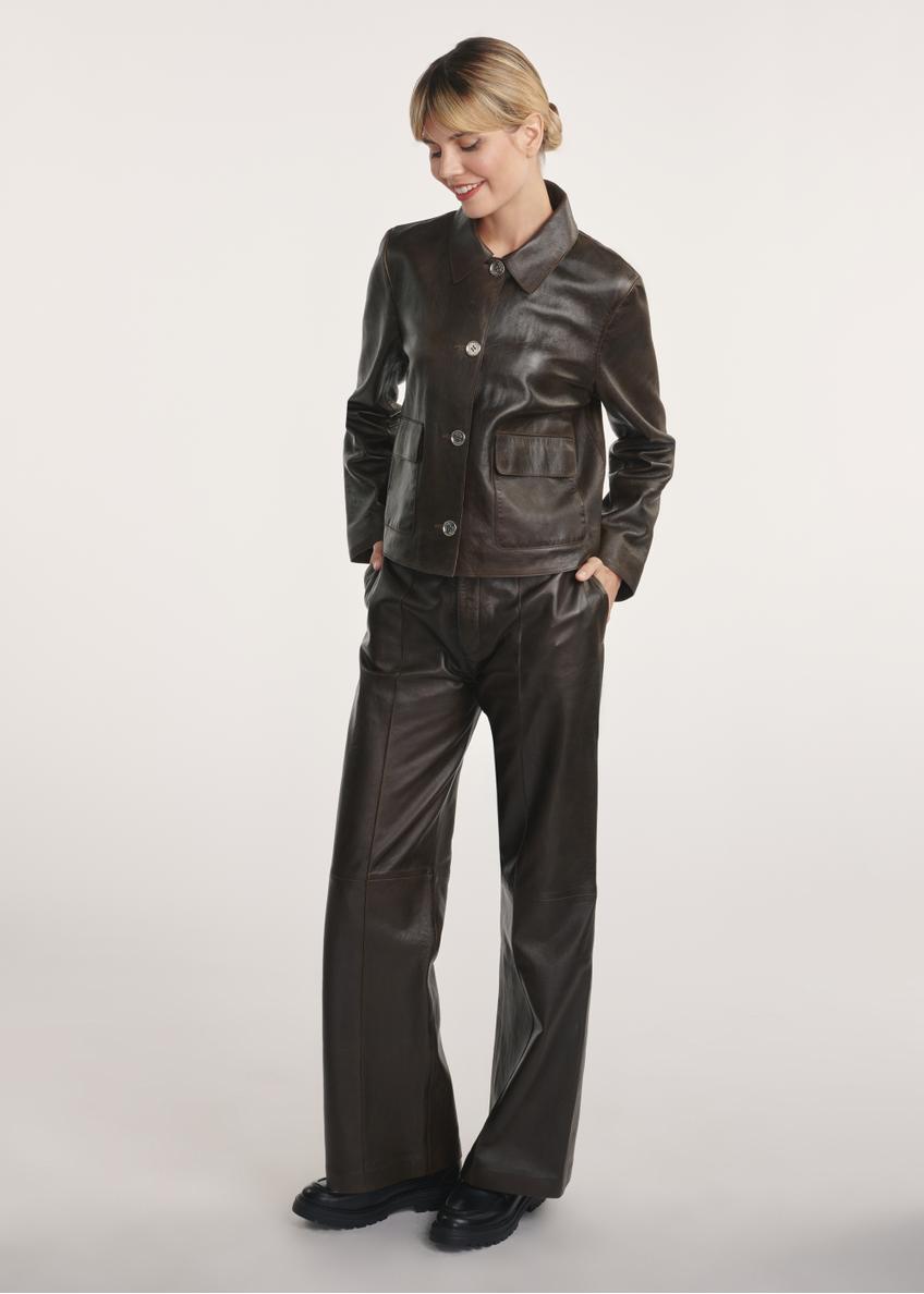 Brown leather short women's jacket KURDS-0552-2868(Z25) - front view of the product on the model. The entire silhouette is visible.