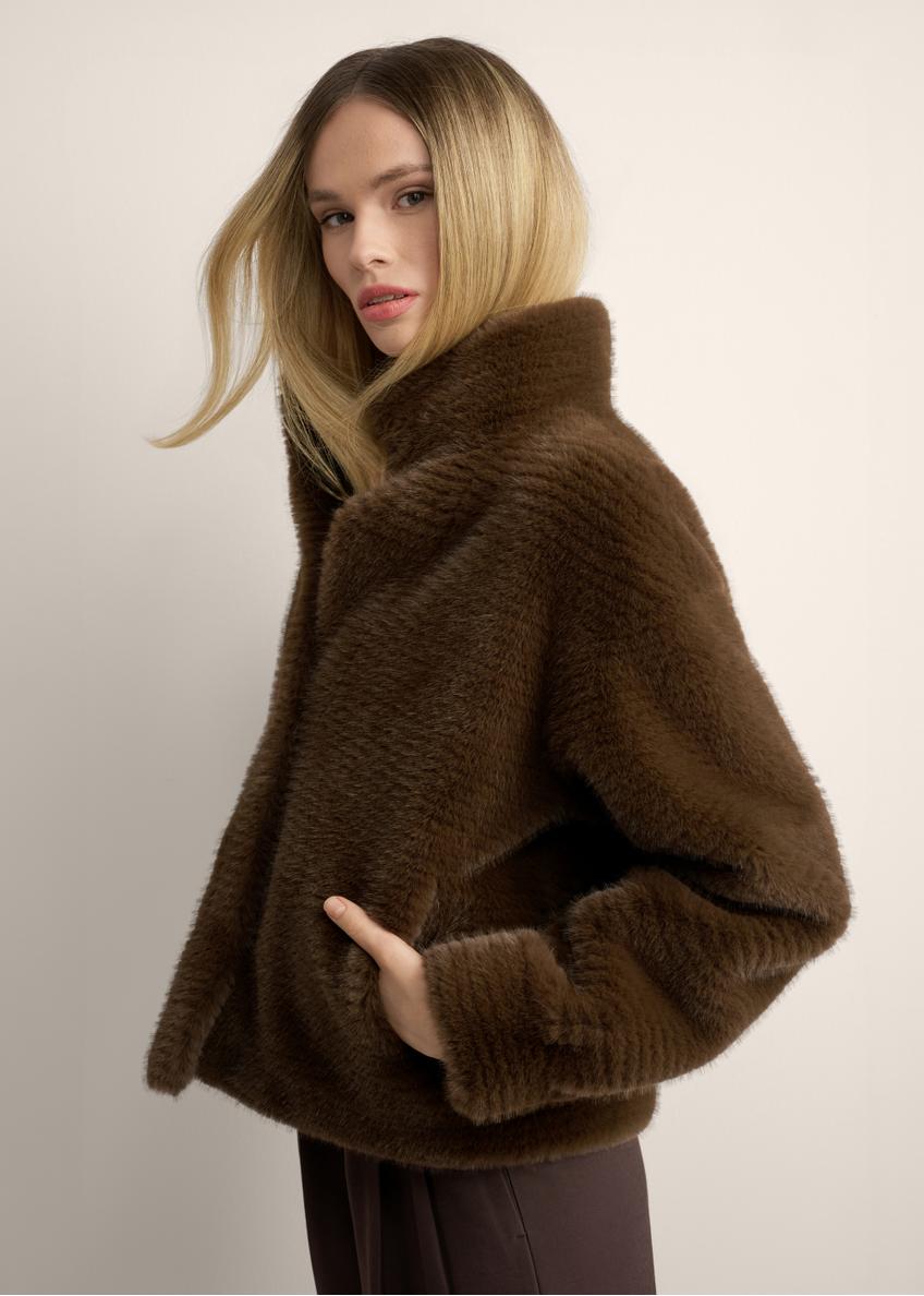 Women's short brown fur coat FUTDP-0078-1H(Z26), side view of the product on the model. Half of the silhouette visible.