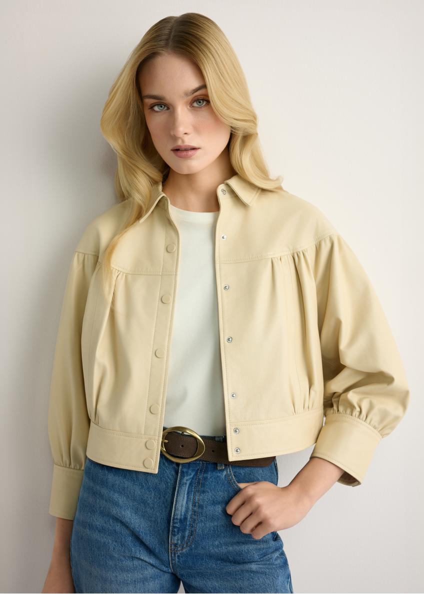 Light yellow women's leather jacket KURDS-0574-2A(W26), front view of the product on the model. Half of the silhouette visible.