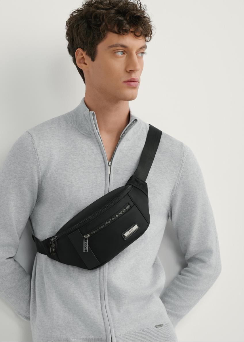 Men's black nylon waist bag TORMN-0407-99(W26), front view of the product on the model, half of the silhouette visible.