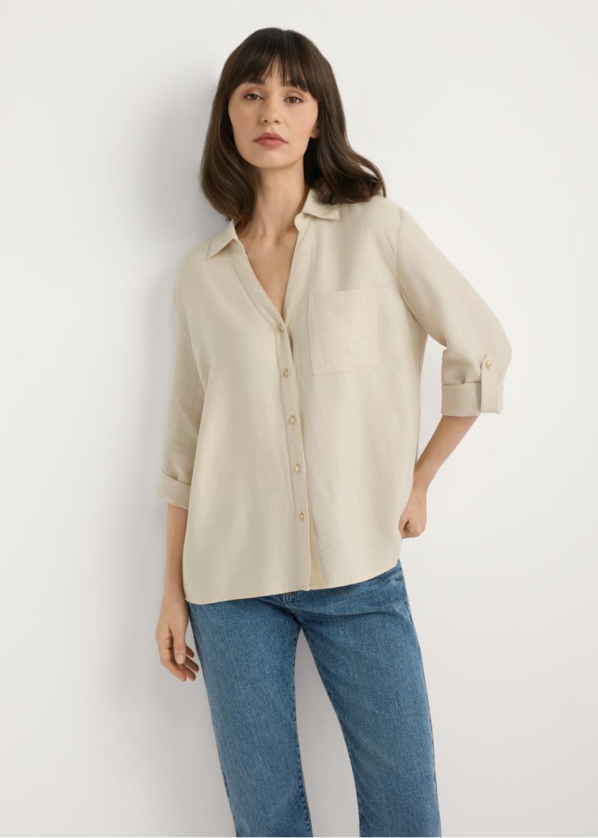 Light beige women's shirt KOSDT-0157A-1A(W26), front view of the product on the model. Half of the silhouette visible.