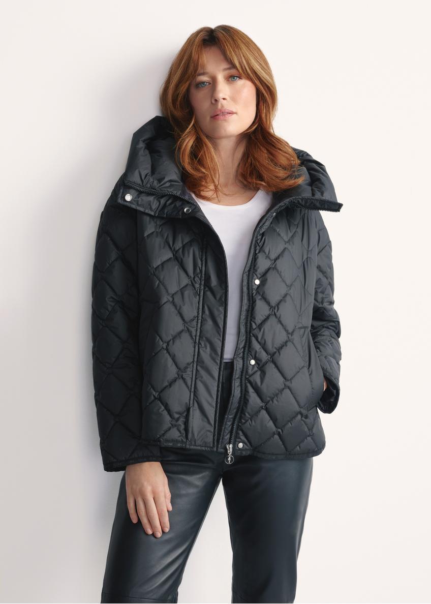 Black women's quilted jacket with hood KURDT-0588-99(Z25), front view of the product on a model, half of the silhouette visible.