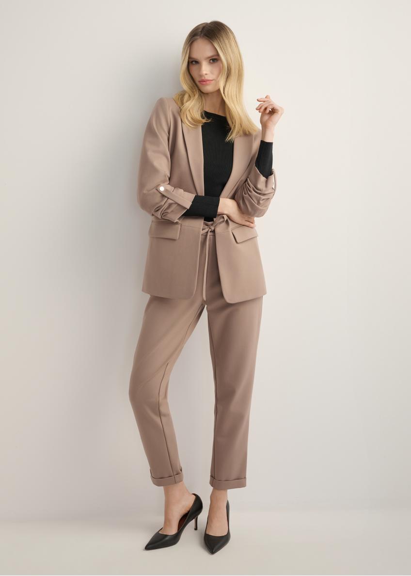 Women's trousers with a crease in a cool beige color SPODT-0098-1K(Z26), front view of the product on the model, the entire silhouette is visible.