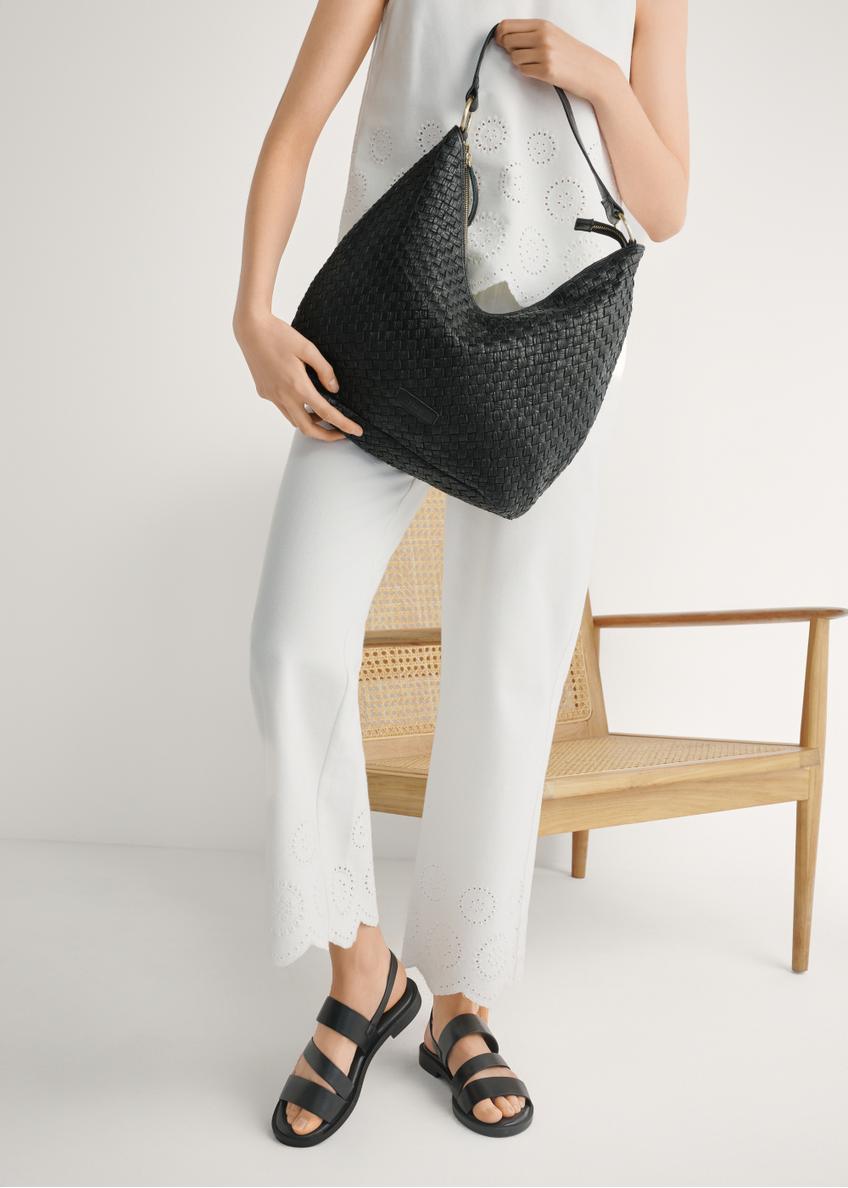 Women's black leather sandals BUTYD-1152-99(W26), front view of the product on the model's feet.