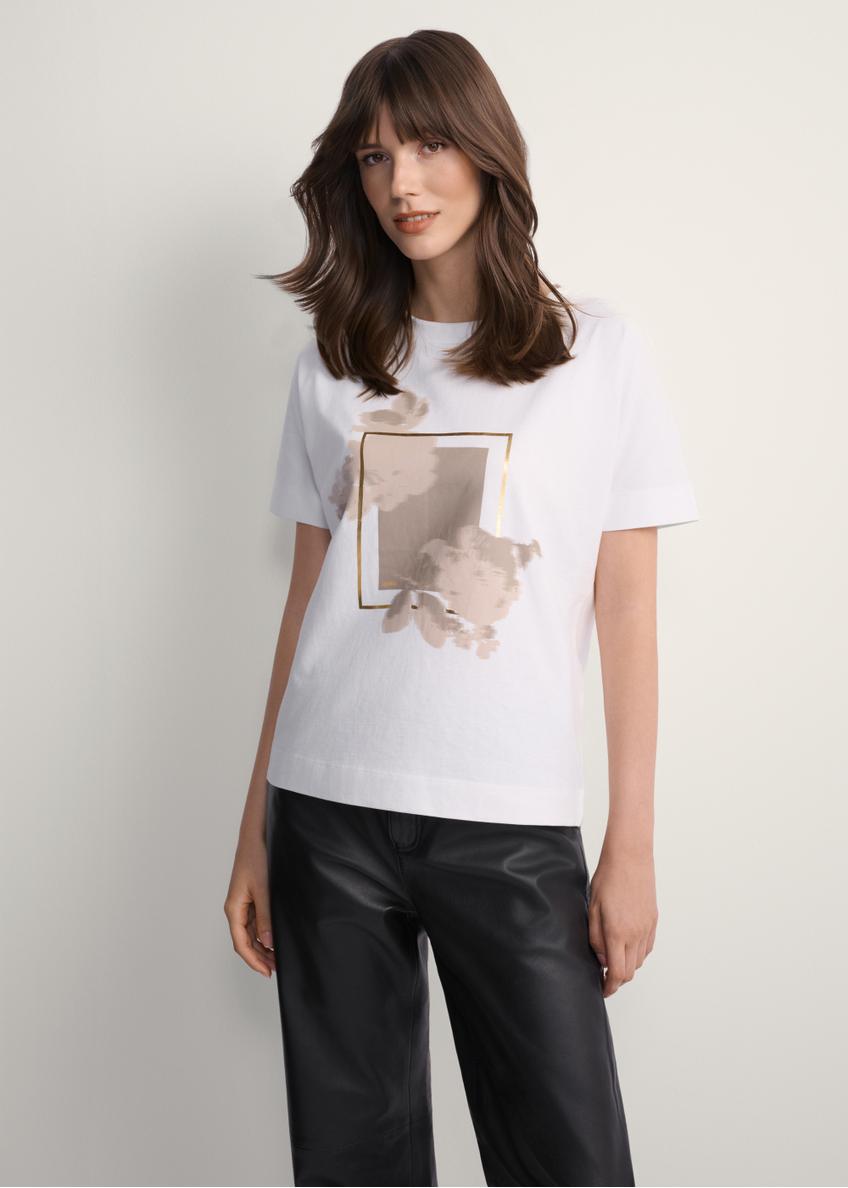 Women's white T-shirt with print TSHDT-0146-12(Z25), front view of the product on the model. Half of the silhouette visible.