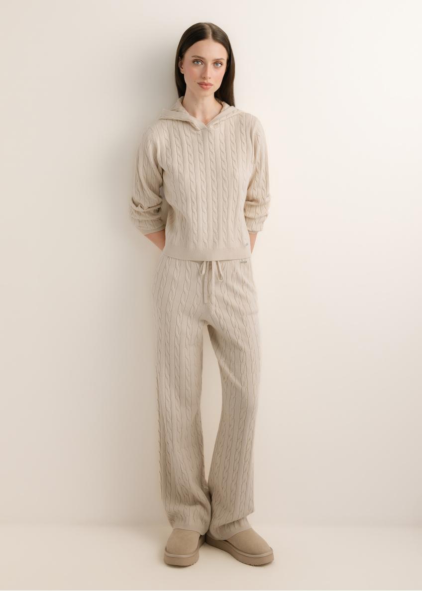 Light beige women's trousers SPODT-0131-1A(Z26), front view of the product on a model. Full-body view.