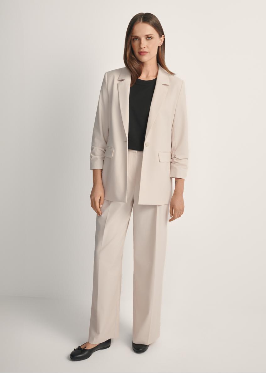 Light beige women's trousers SPODT-0119-1A(W26), front view of the product on the model. Full body visible.