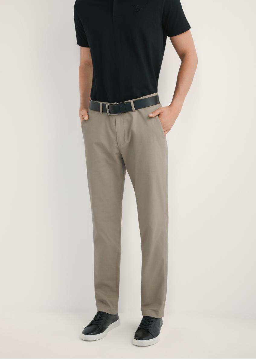 Men's dark beige trousers SPOMT-0121-1K(W26) - front view of the product, on a model, against a light background. Half of the silhouette visible.