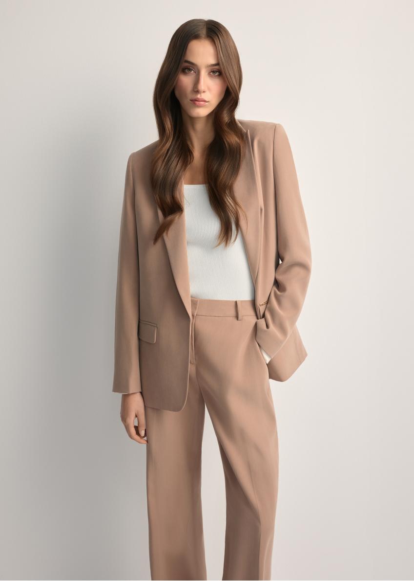 Women's camel blazer ZAKDT-0031A-1D(W26) - front view of the product, on a model, against a light background. Knee-length silhouette visible.