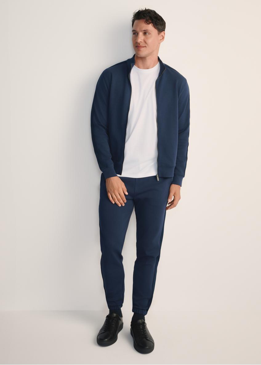Men's navy blue trousers SPOMT-0111-68(Z25), front view of the product on the model. Full body visible.