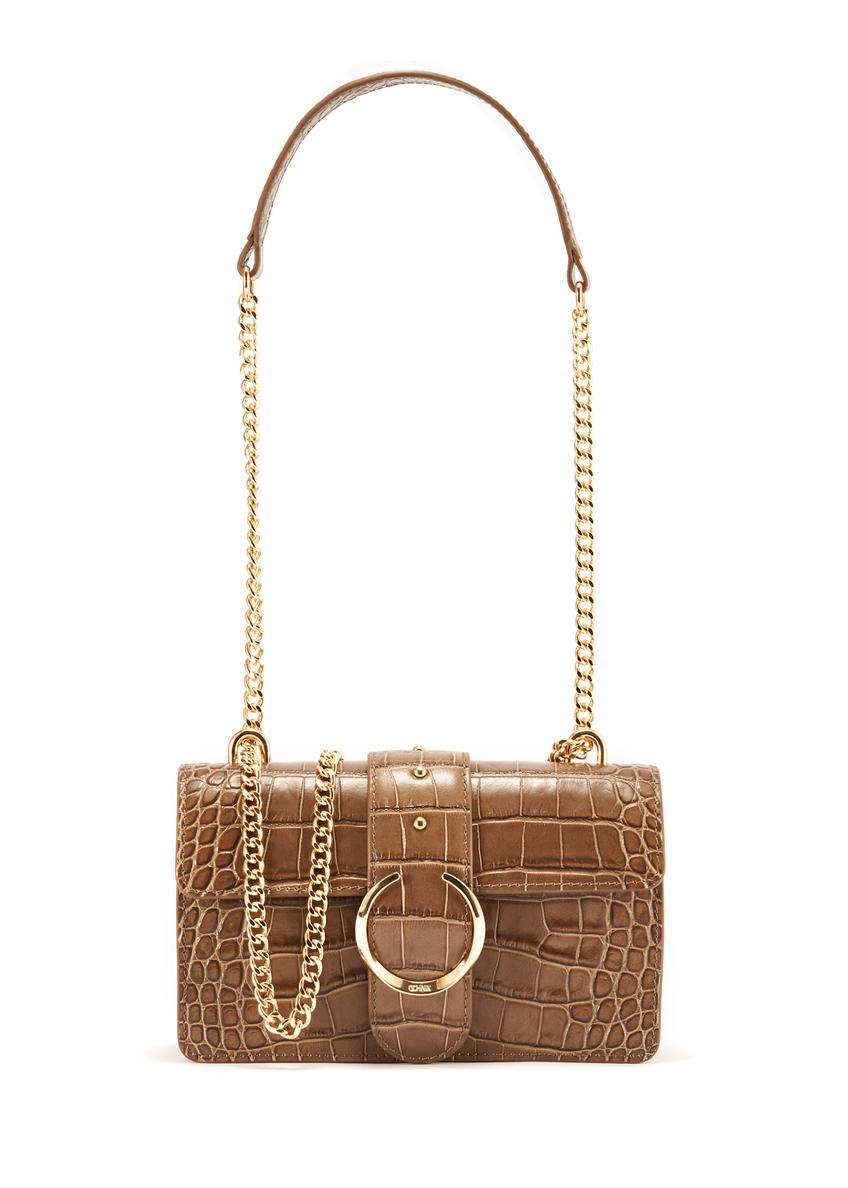 Beige small croco leather handbag TORES-1117-81(W25) - view of a model on a white background. Half of the silhouette visible.
