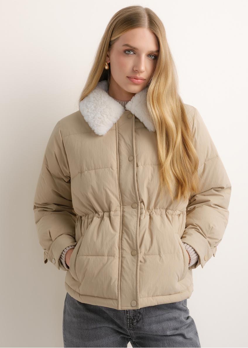 Women's short beige jacket KURDT-0695-1B(Z26), front view of the product on the model. Half of the silhouette visible.