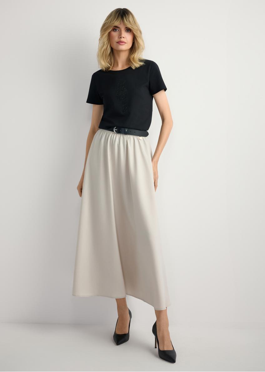Beige midi skirt SPCDT-0125-1A(W26) - front view of the product, on a model, against a light background. The entire silhouette is visible.