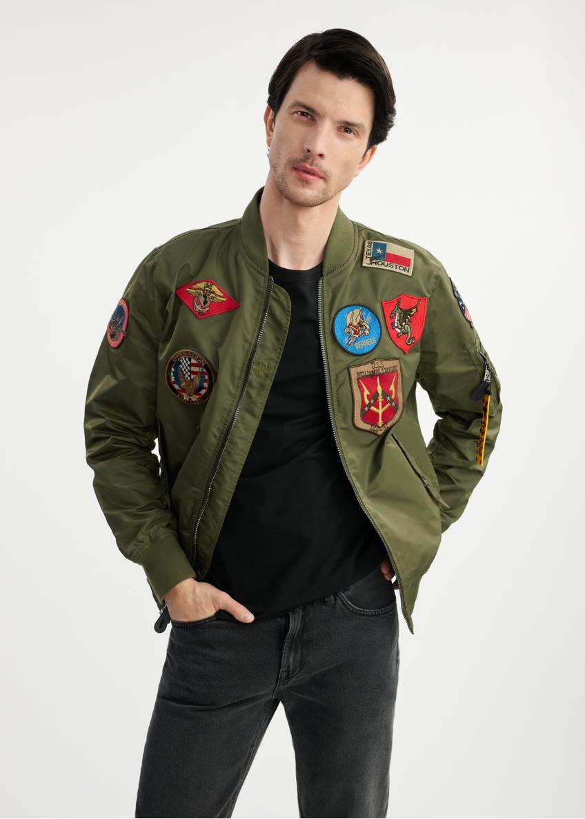 Olive men's TOP GUN KURMT-0381-57(W25) bomber jacket - front view on a model on a white background. Half of the silhouette visible.